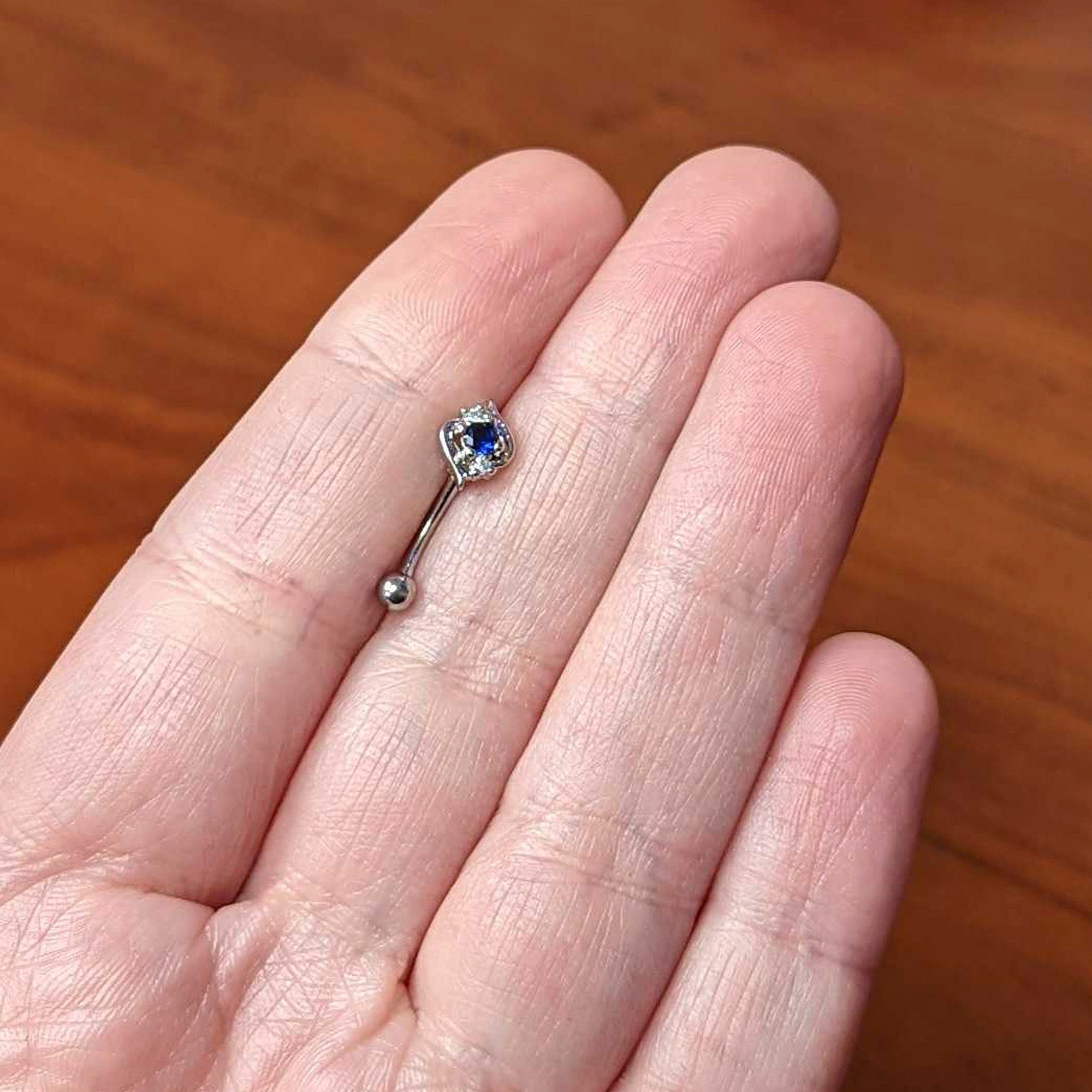 16G 5/16 Clear Blue Gem Oval Swirl Curved Eyebrow Ring