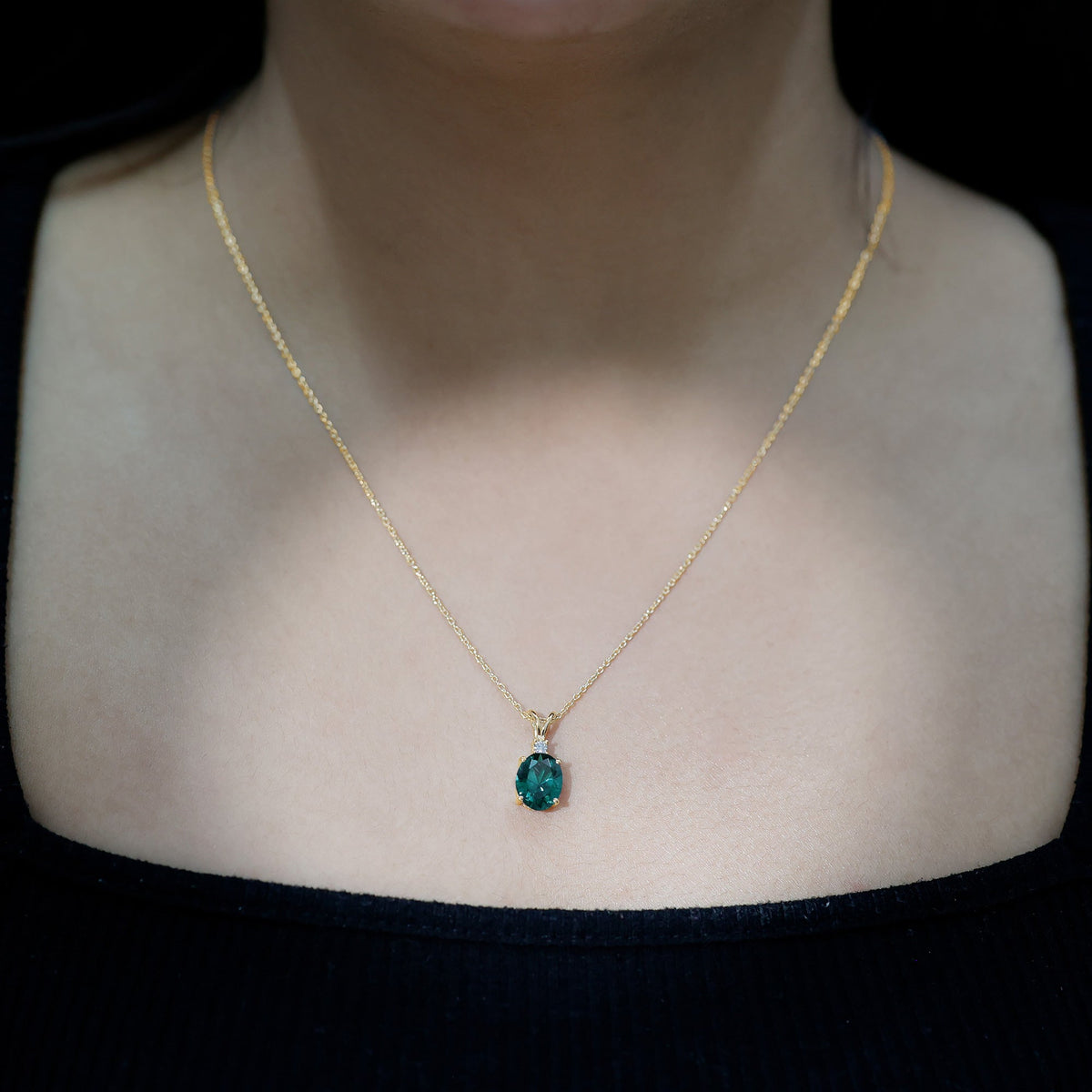 Oval Created Emerald and Moissanite Solitaire Pendant