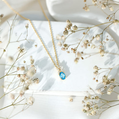 Oval Cut 0.65 Carat Swiss Blue Topaz and Diamond Flower Necklace with Chain