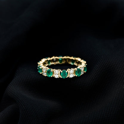 Oval Emerald and Moissanite Eternity Wedding Band