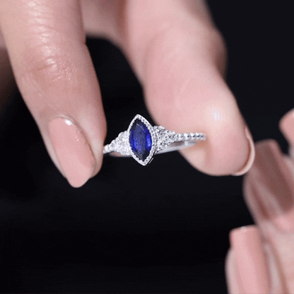 Vintage Style 0.7 Carat Lab Grown Blue Sapphire Marquise Engagement Ring with Diamond Trio