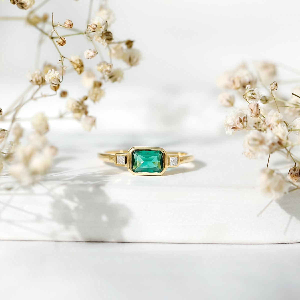 1 Carat Lab Grown Emerald 3 Stone Engagement Ring with Diamond in East West Style