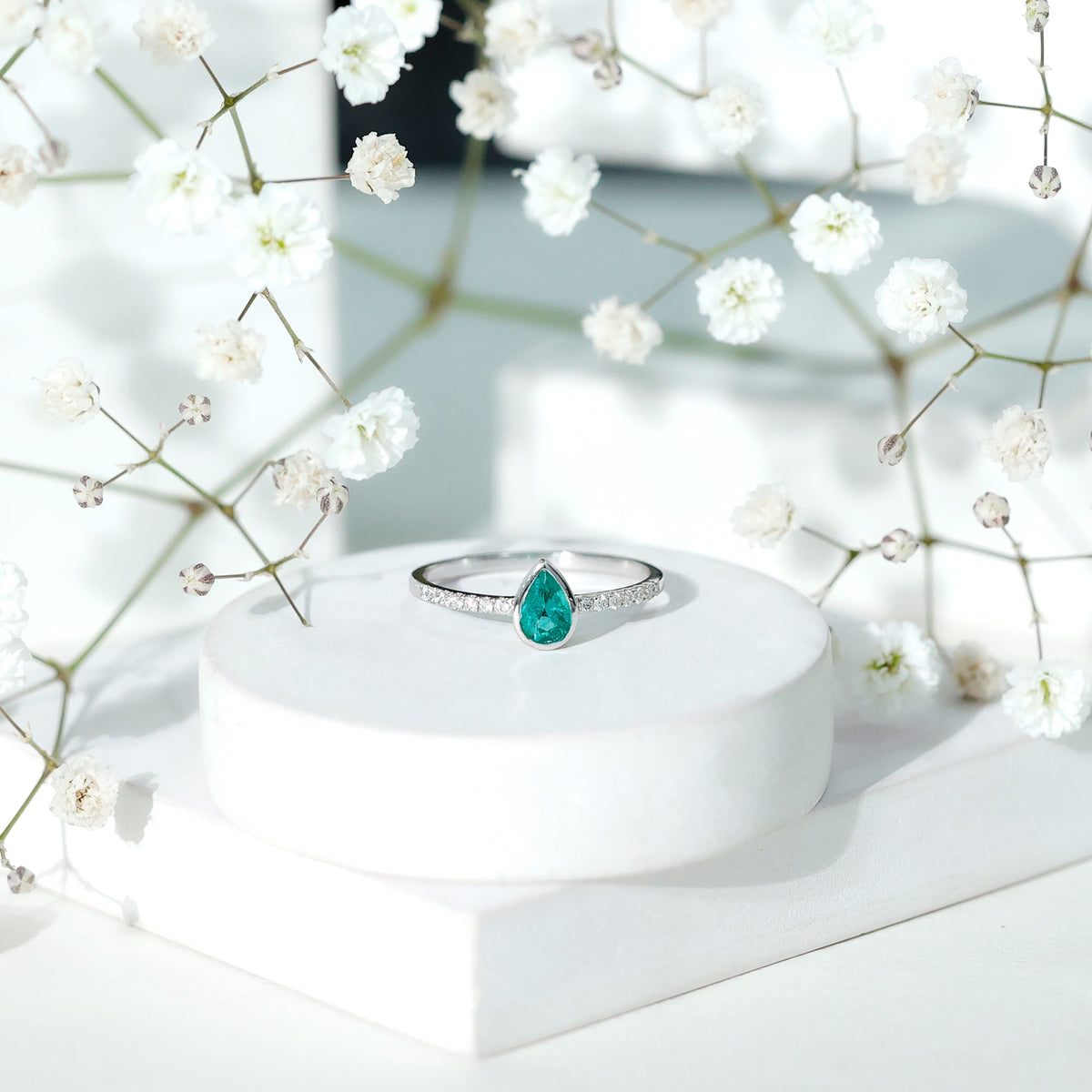 Pear Shaped Emerald Engagement Ring with Diamond Side Stones
