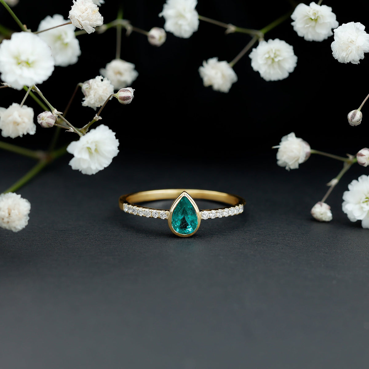 Pear Shaped Emerald Engagement Ring with Diamond Side Stones