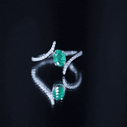 Oval Shaped Emerald Bypass Engagement Ring with Diamonds