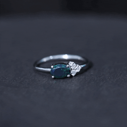 Oval Black Opal East West Ring with Diamond Trio