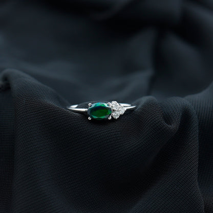 Oval Black Opal East West Ring with Diamond Trio