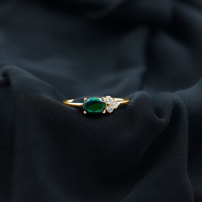 Oval Black Opal East West Ring with Diamond Trio
