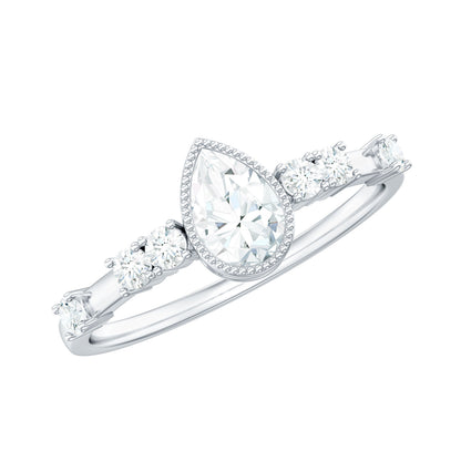 0.7 Carat Pear Cut Moissanite Solitaire Engagement Ring with Beaded Details