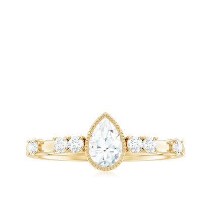 0.7 Carat Pear Cut Moissanite Solitaire Engagement Ring with Beaded Details
