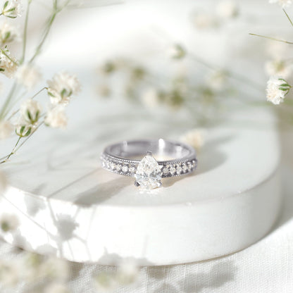 Pear Shaped Moissanite Solitaire Engagement Ring with Beaded Design