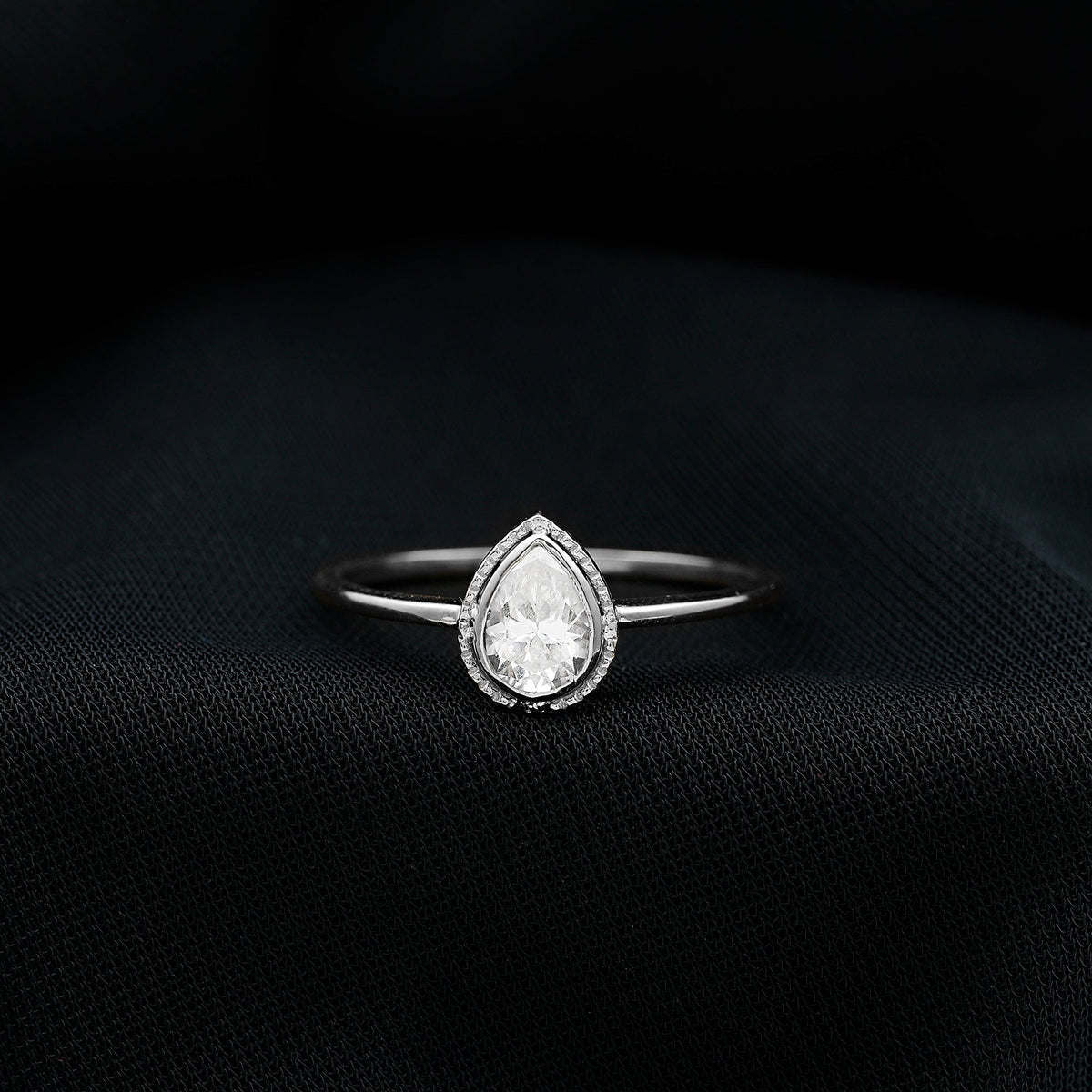 Pear Shaped Moissanite Solitaire Engagement Ring in Bezel Setting