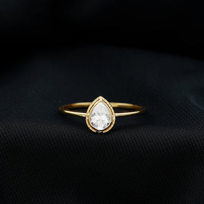 Pear Shaped Moissanite Solitaire Engagement Ring in Bezel Setting