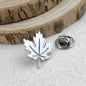 New maple leaf men's lapel pin, 316L stainless steel gold-plated badge, black brooch for suit accessories, gift for father